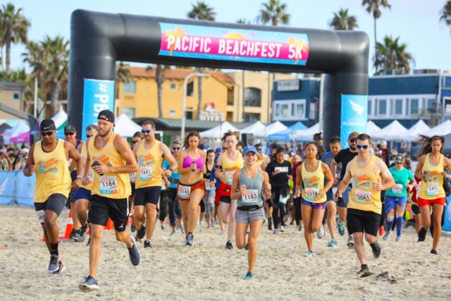 Early Wave Pacific Beachfest Runners from the start line running the 5K
