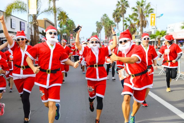 Santas running together